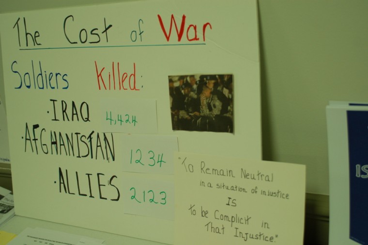 A poster shows the death tallies of U. S. soldiers in Iraq and Afghanistan
