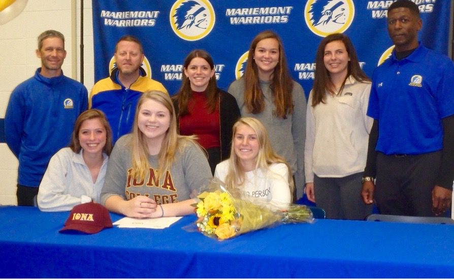Rebekah+Justice+gathers+with+family+and+coaches+during+her+signing+day+at+Mariemont+High+School+last+year.