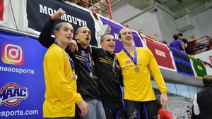 Iona mens swimming and diving team had bald heads while competing in the MAAC Championship. 