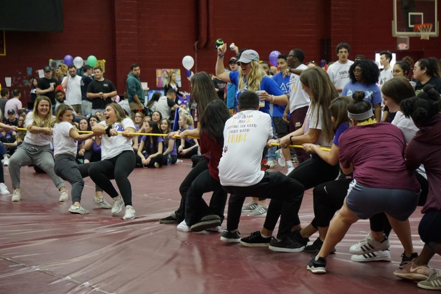 Iona Relay participants take part in a tug-of-war competition, which was one of the many activities that Iona students could participate in during the event.