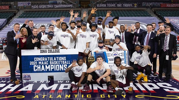 The Iona men’s basketball team celebrating a 60-51 win over Fairfield in the Metro Atlantic Athletic Conference men’s basketball championship game in Boardwalk Hall, Atlantic City, New Jersey. The win gave the Gaels their fifth consecutive MAAC championship and an automatic bid to the Round of 64 game against Alabama