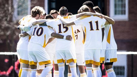 Iona men’s soccer team huddling up during their March 25 game against Manhattan College at Van Cortlandt Park in Riverdale, NY.  