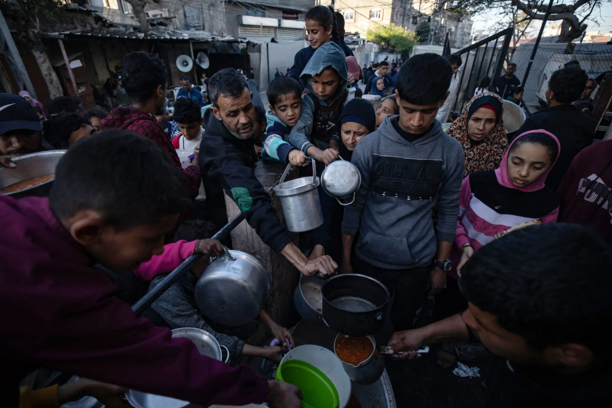Photo courtesy of Haitham ImadEPA, via Shutterstock. Displaced Palestinians waited to receive donated food on Mar. 12, the second day of Ramadan.