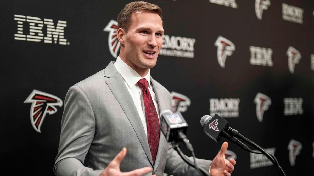Photo by Mike Stewart (AP Photo). Kirk Cousins speaks to the media during his introductory Falcons press conference. 